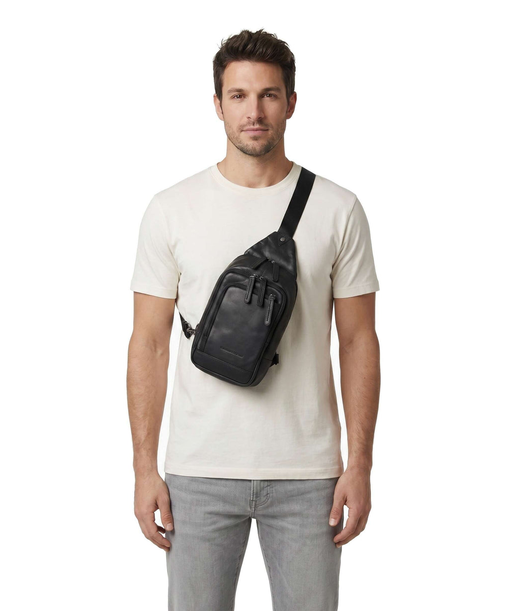 The Chesterfield Brand Wax Pull Up Cow Riga Sling bag black